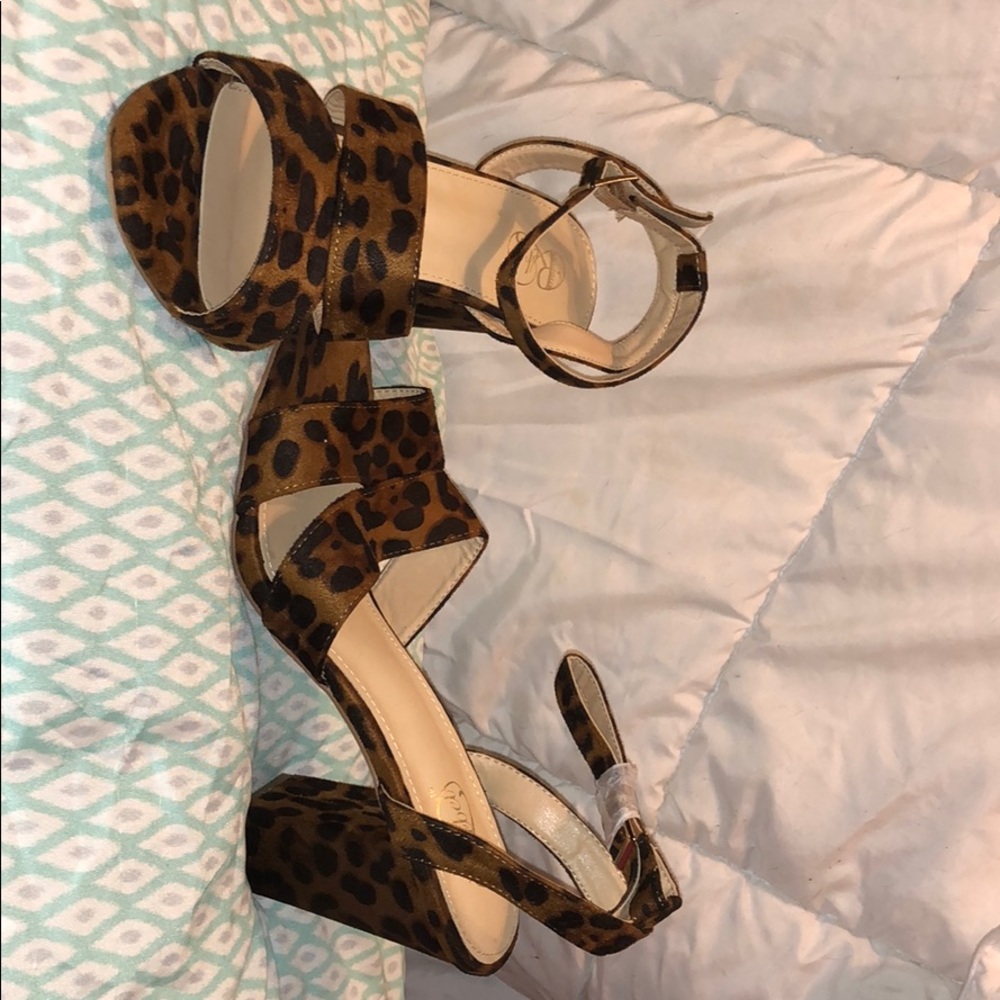 Cheeta print heeled sandals.